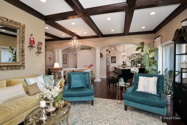 living room featuring wood-type flooring, beam ceiling, ornate columns, and coffered ceiling