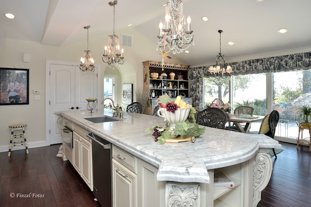 kitchen with lofted ceiling, sink, stainless steel dishwasher, a center island with sink, and dark hardwood / wood-style floors