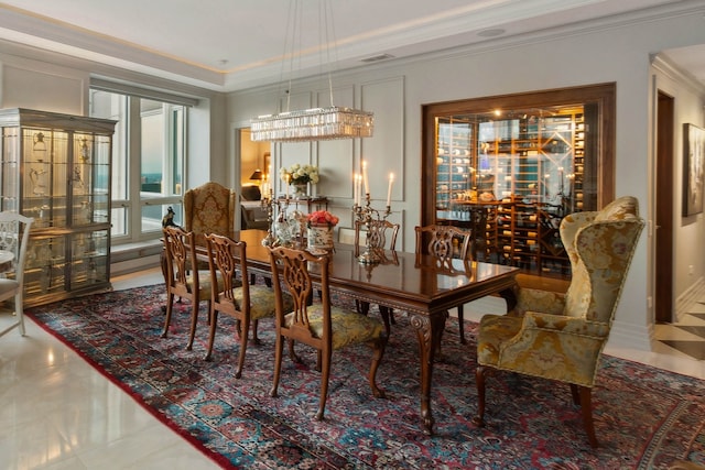 dining area featuring crown molding