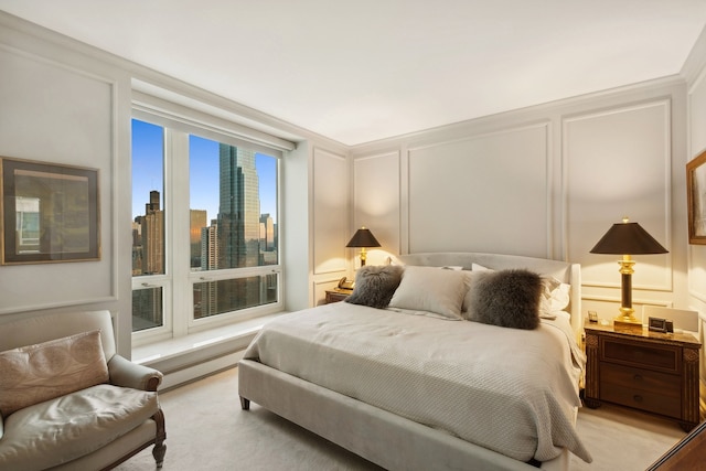 bedroom featuring light carpet