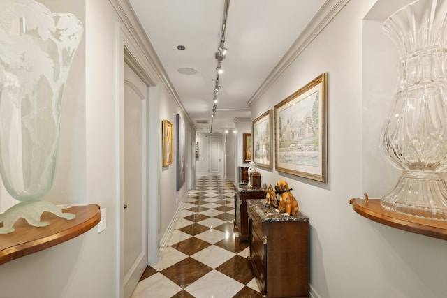 corridor featuring track lighting and crown molding