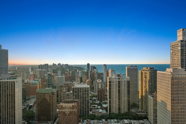 property's view of city featuring a water view