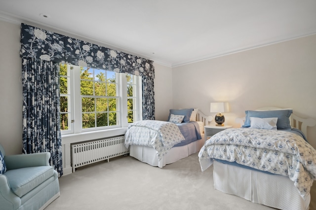 carpeted bedroom featuring radiator and ornamental molding