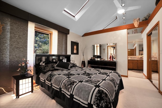 bedroom featuring ensuite bathroom, ceiling fan, light colored carpet, and high vaulted ceiling