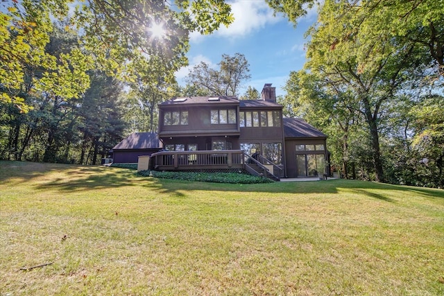 rear view of property with a yard