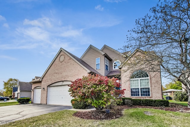 view of front of property with a garage and a front lawn