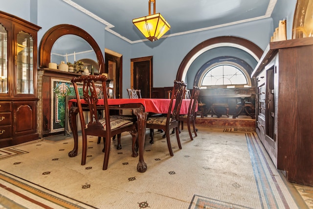 dining area with crown molding