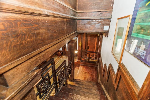 stairs with hardwood / wood-style floors