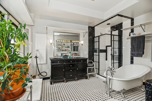 bathroom featuring vanity and separate shower and tub