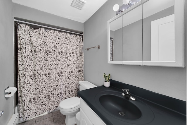 bathroom featuring toilet, vanity, tile patterned floors, and a shower with curtain