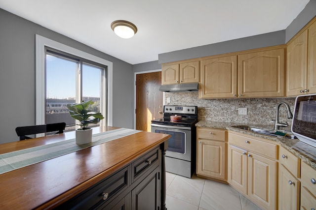 kitchen with light tile patterned floors, stainless steel range with electric cooktop, backsplash, light stone countertops, and light brown cabinetry