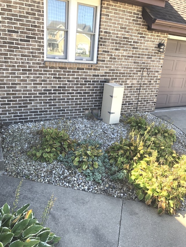 view of side of home with a garage