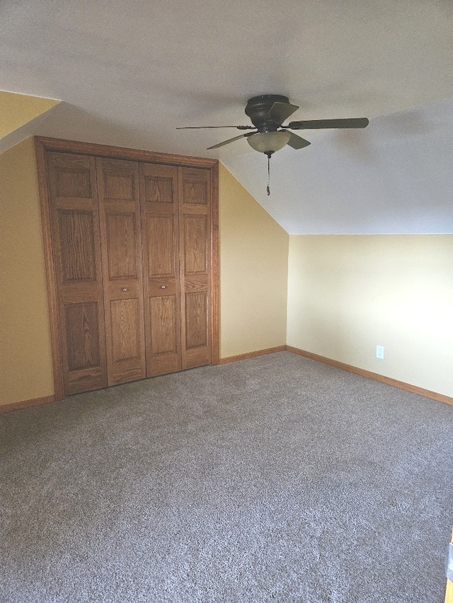 additional living space featuring lofted ceiling, carpet floors, a textured ceiling, and ceiling fan