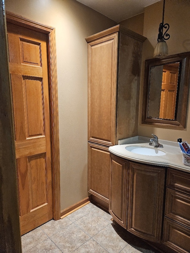 bathroom with vanity and tile patterned flooring