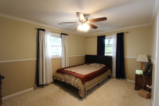 carpeted bedroom with crown molding, multiple windows, and ceiling fan