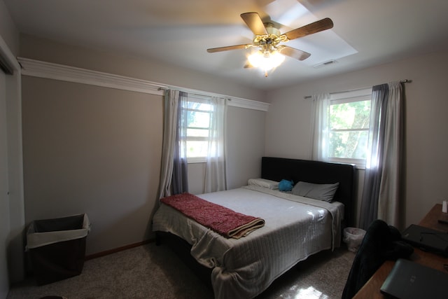 bedroom featuring dark carpet and ceiling fan