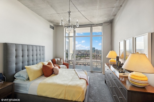 carpeted bedroom featuring multiple windows, access to outside, a wall of windows, and an inviting chandelier