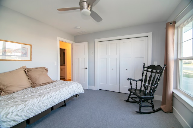 carpeted bedroom with a closet and ceiling fan