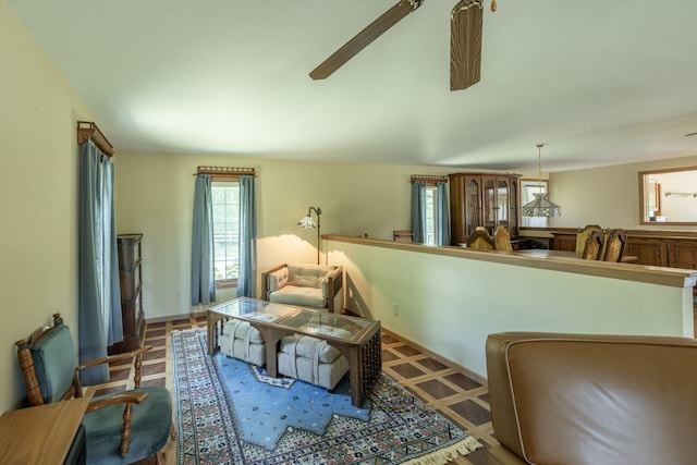 sitting room with ceiling fan