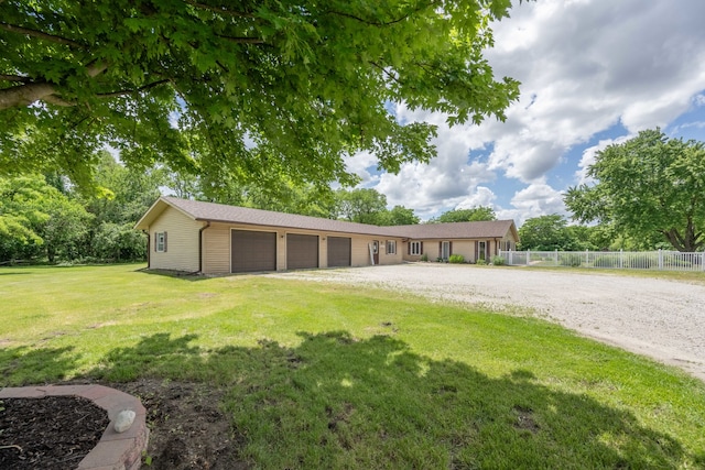 garage featuring a lawn