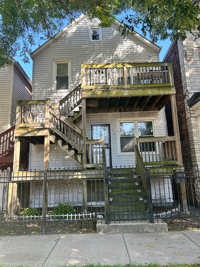 rear view of house with a wooden deck