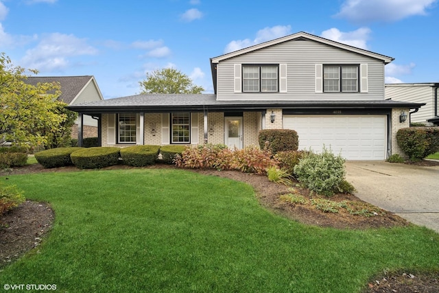 view of front of property with concrete driveway, an attached garage, brick siding, and a front lawn