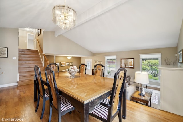 dining space featuring stairway, wood finished floors, baseboards, vaulted ceiling with beams, and a notable chandelier