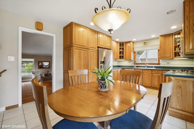 dining space featuring light tile patterned floors, recessed lighting, and baseboards