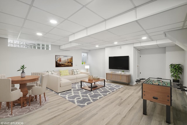 living area featuring recessed lighting, visible vents, a paneled ceiling, and wood finished floors