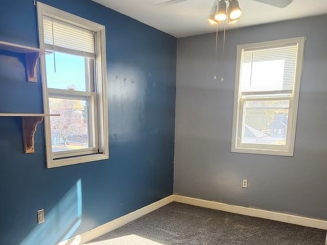 spare room with ceiling fan and carpet floors