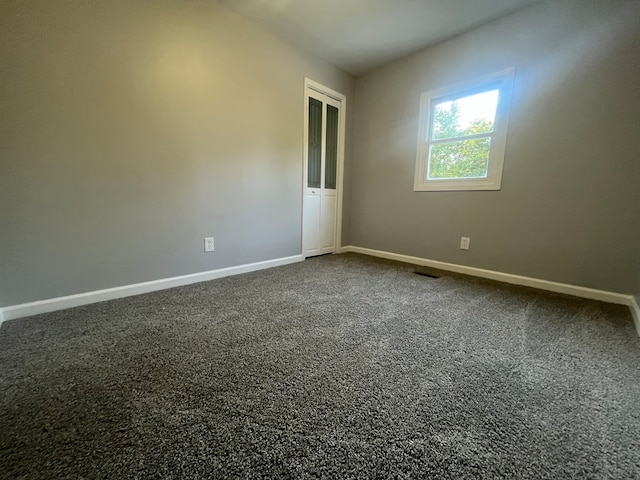 spare room with carpet floors