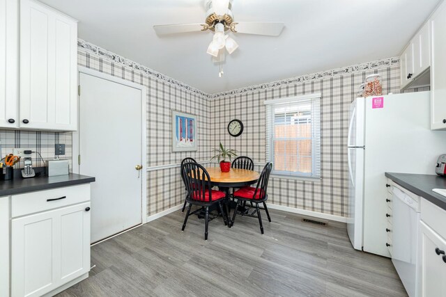 814 Countryside Dr, Wheaton, IL 60187 - kitchen with wallpapered walls, dishwasher, dark countertops, baseboards, and ceiling fan