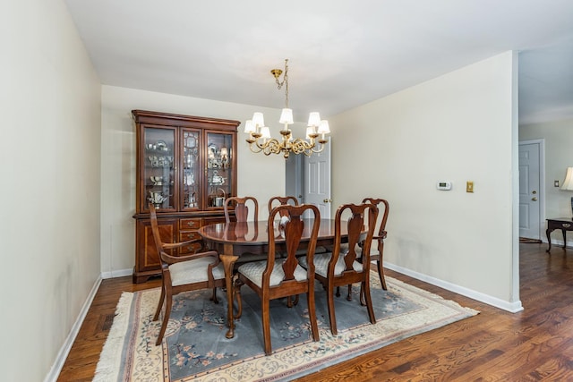 814 Countryside Dr, Wheaton, IL 60187 - dining room featuring a chandelier, dark wood-style floors, and baseboards