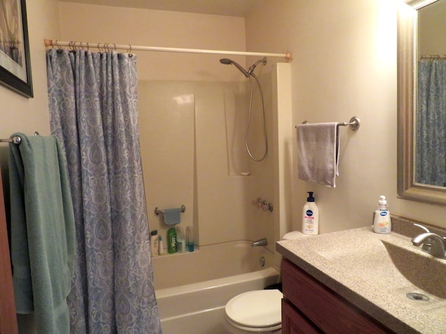 full bathroom with shower / bath combo with shower curtain, vanity, and toilet