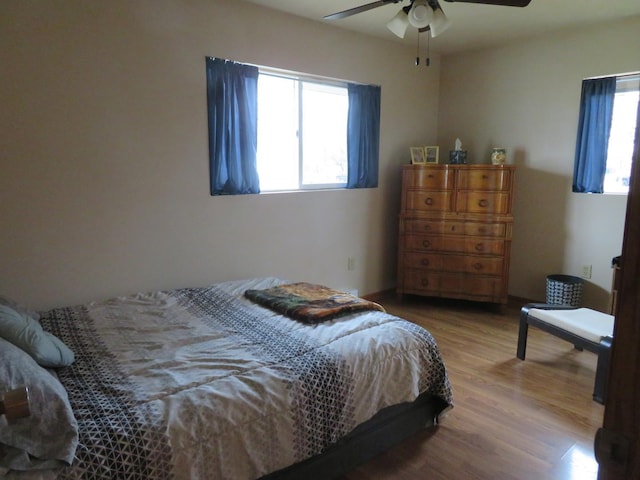 bedroom featuring hardwood / wood-style flooring and ceiling fan