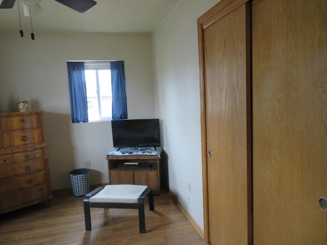 sitting room featuring ceiling fan and light hardwood / wood-style flooring