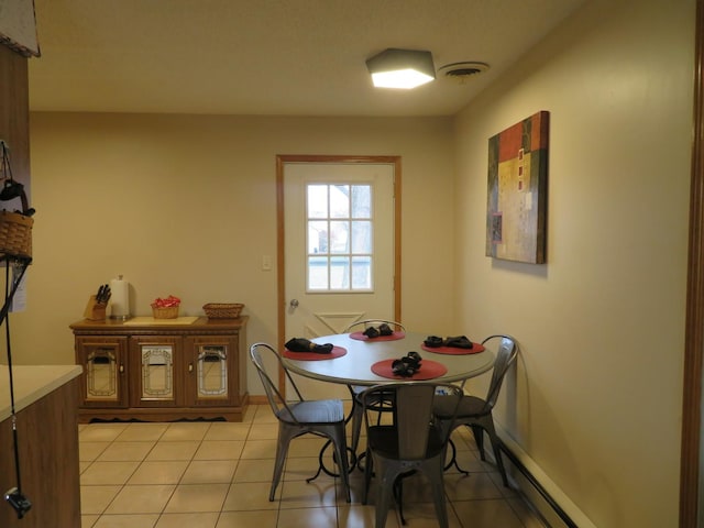 dining room featuring light tile patterned floors