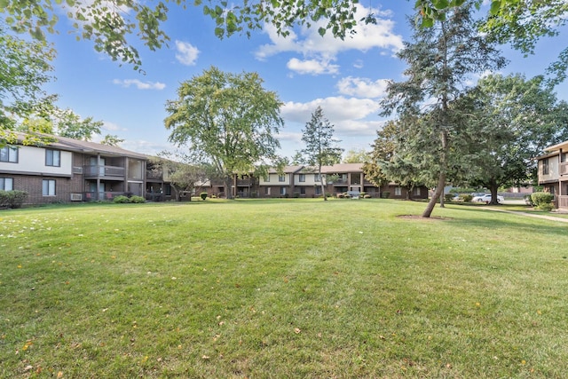 view of community featuring a lawn