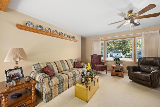 carpeted living room featuring ceiling fan