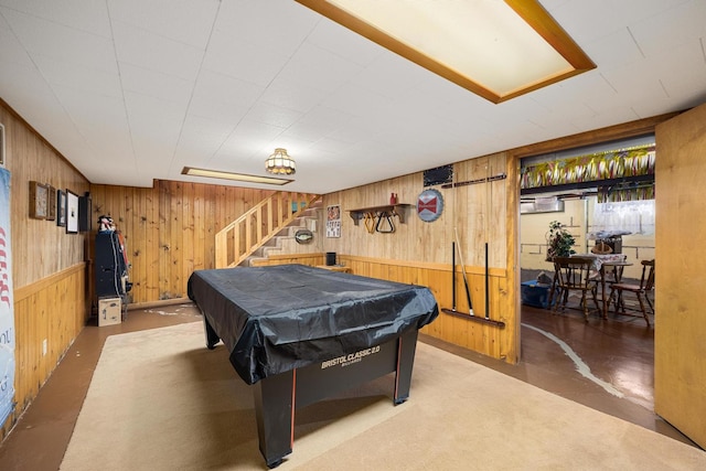 rec room featuring concrete floors, wood walls, and billiards