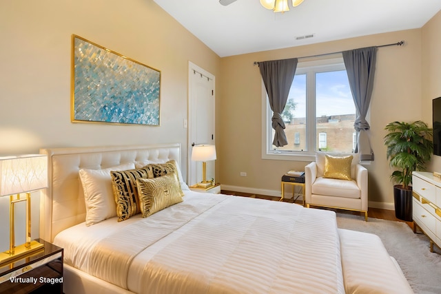 bedroom with hardwood / wood-style floors and ceiling fan