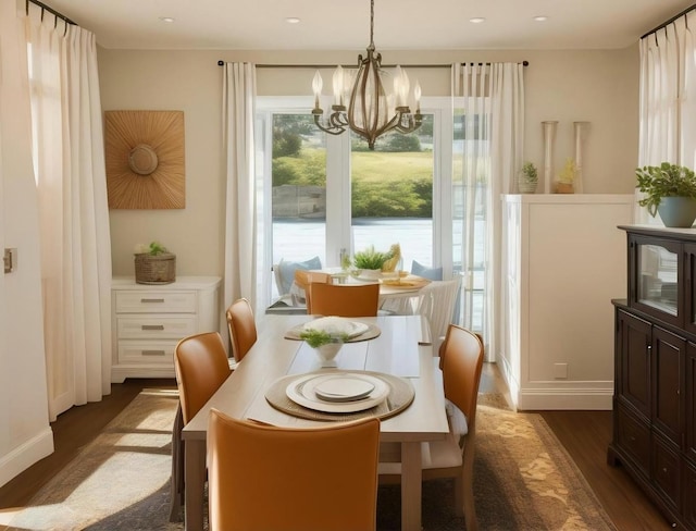 dining space with an inviting chandelier and dark hardwood / wood-style floors