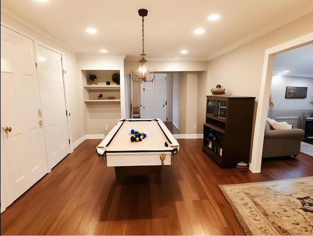 playroom featuring billiards, ornamental molding, and dark hardwood / wood-style flooring