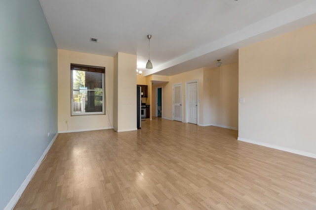 unfurnished living room with light hardwood / wood-style floors