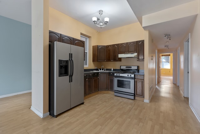 kitchen featuring dark brown cabinets, stainless steel appliances, light wood-type flooring, and a chandelier