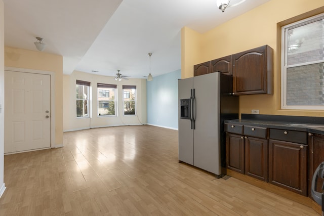 kitchen featuring stainless steel fridge, ceiling fan, dark brown cabinetry, and light hardwood / wood-style flooring