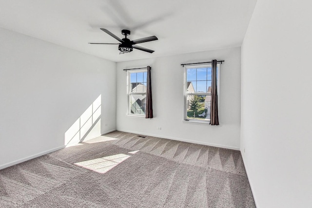 carpeted empty room with ceiling fan