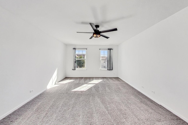 unfurnished room featuring light colored carpet and ceiling fan