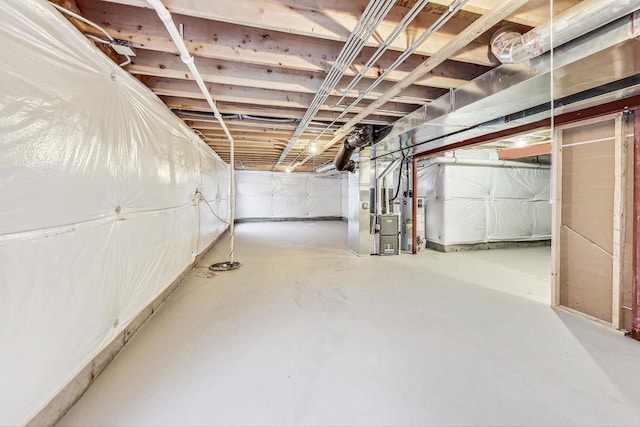 basement featuring gas water heater