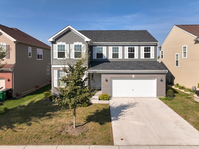 front facade featuring a front yard and a garage